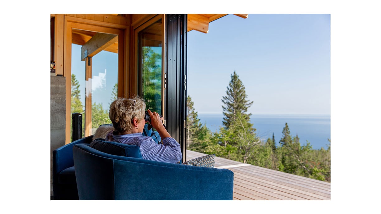 man sitting on patio looking at the view