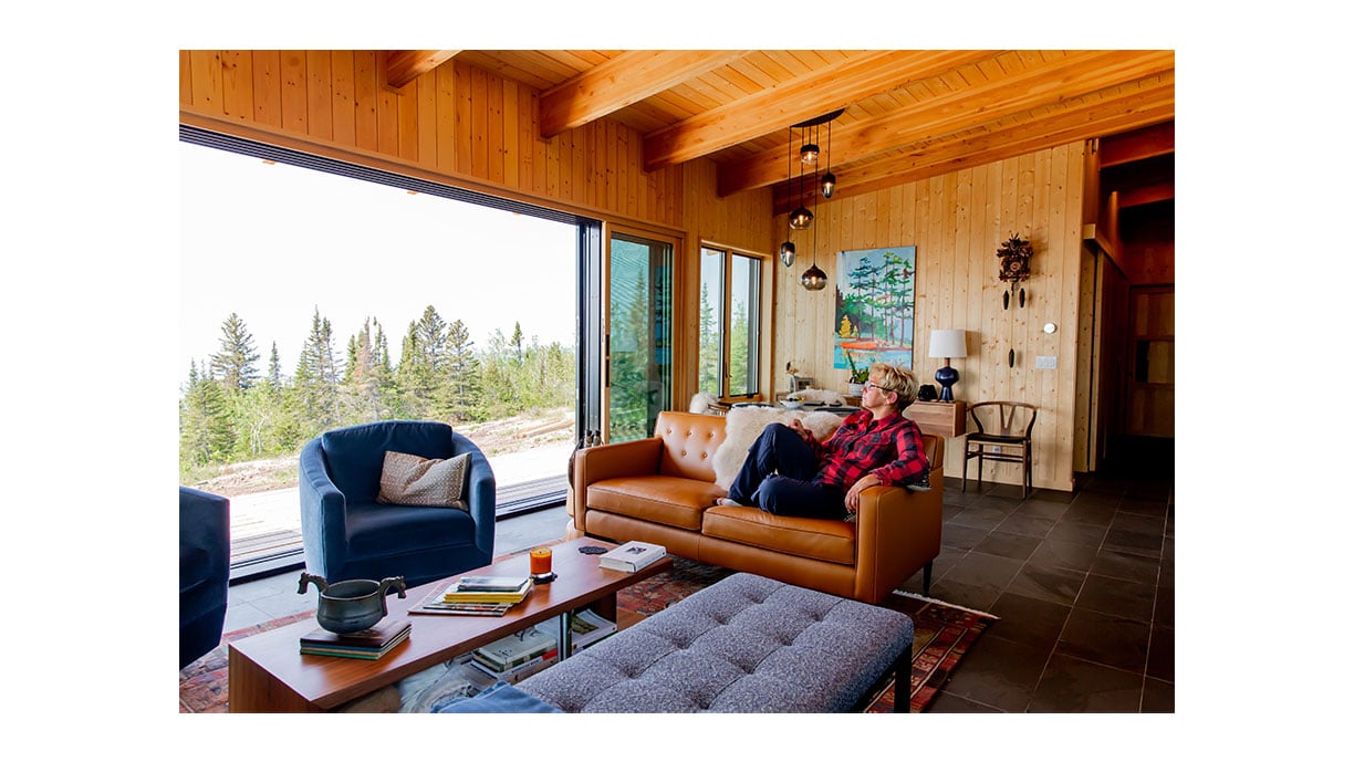 view of andersen multi slide patio doors in sunroom