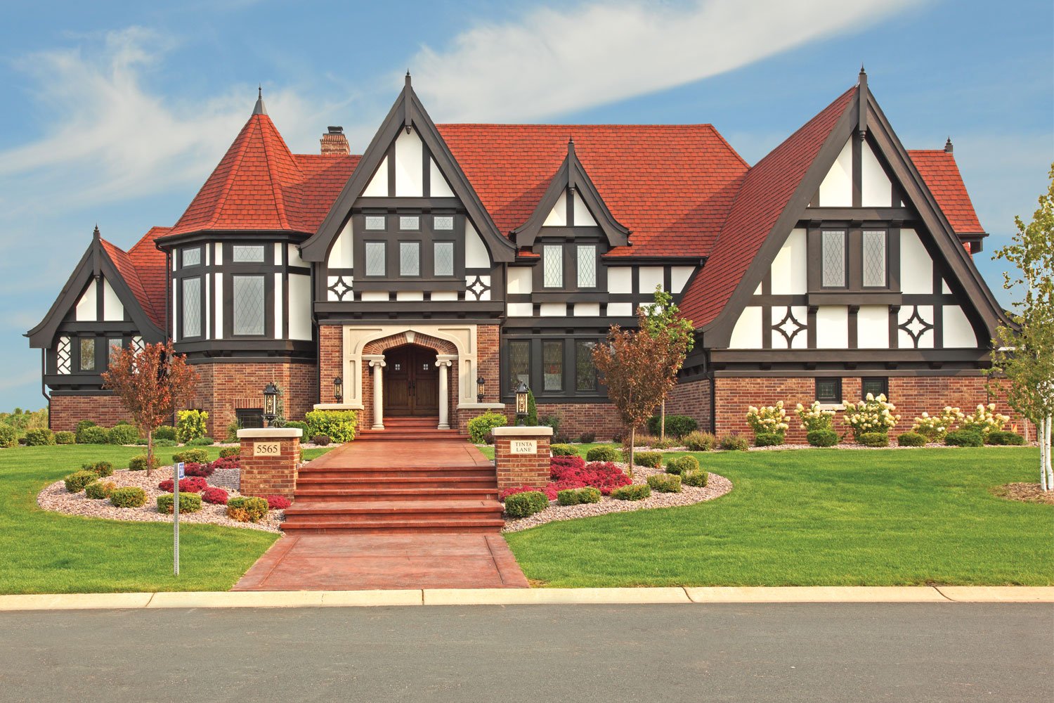 Victorian home with a red roof and art glass windowns