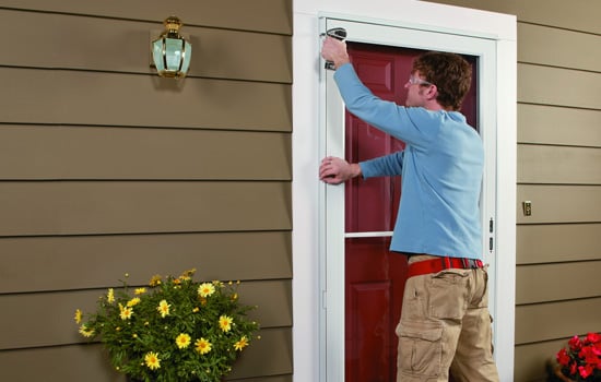 contractor replacing andersen storm door