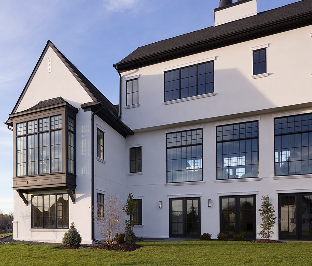 Andersen 400 Series Casement and Picture windows with full divided light grille patterns in Black exterior color.