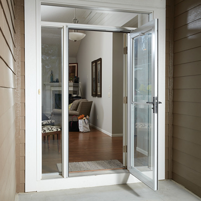 front entrance of home with white andersen storm door open
